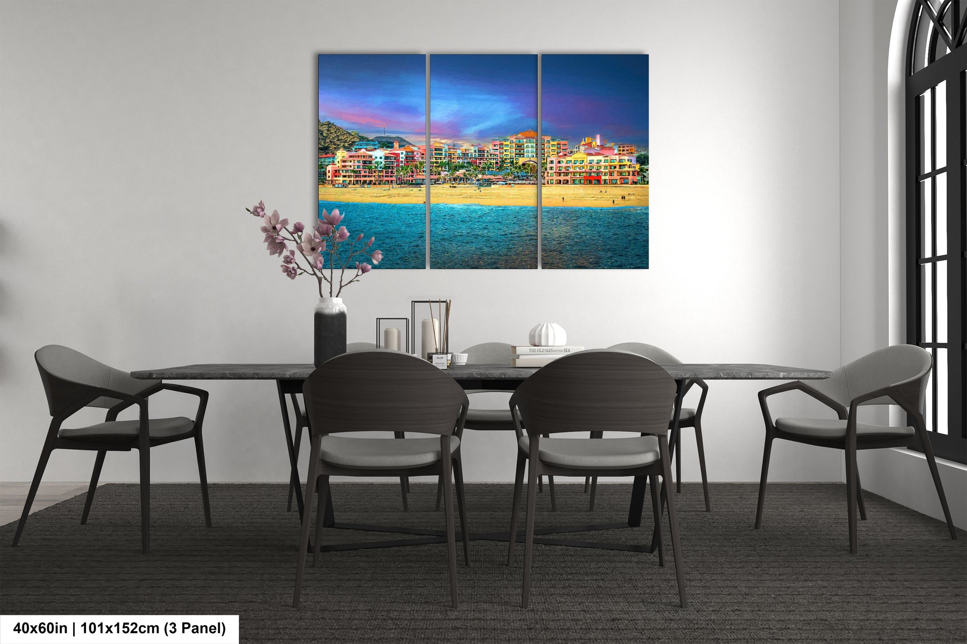 a dining room table with chairs and a painting on the wall