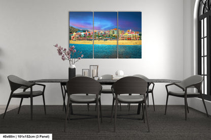 a dining room table with chairs and a painting on the wall