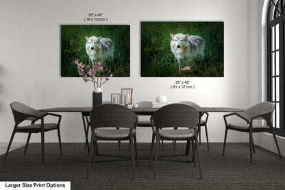 a dining room table with chairs and two pictures on the wall