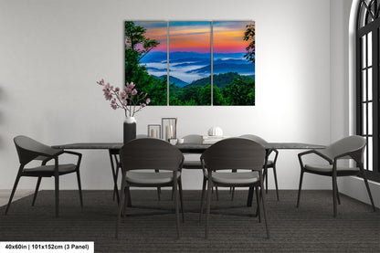 a dining room table with chairs and a painting on the wall