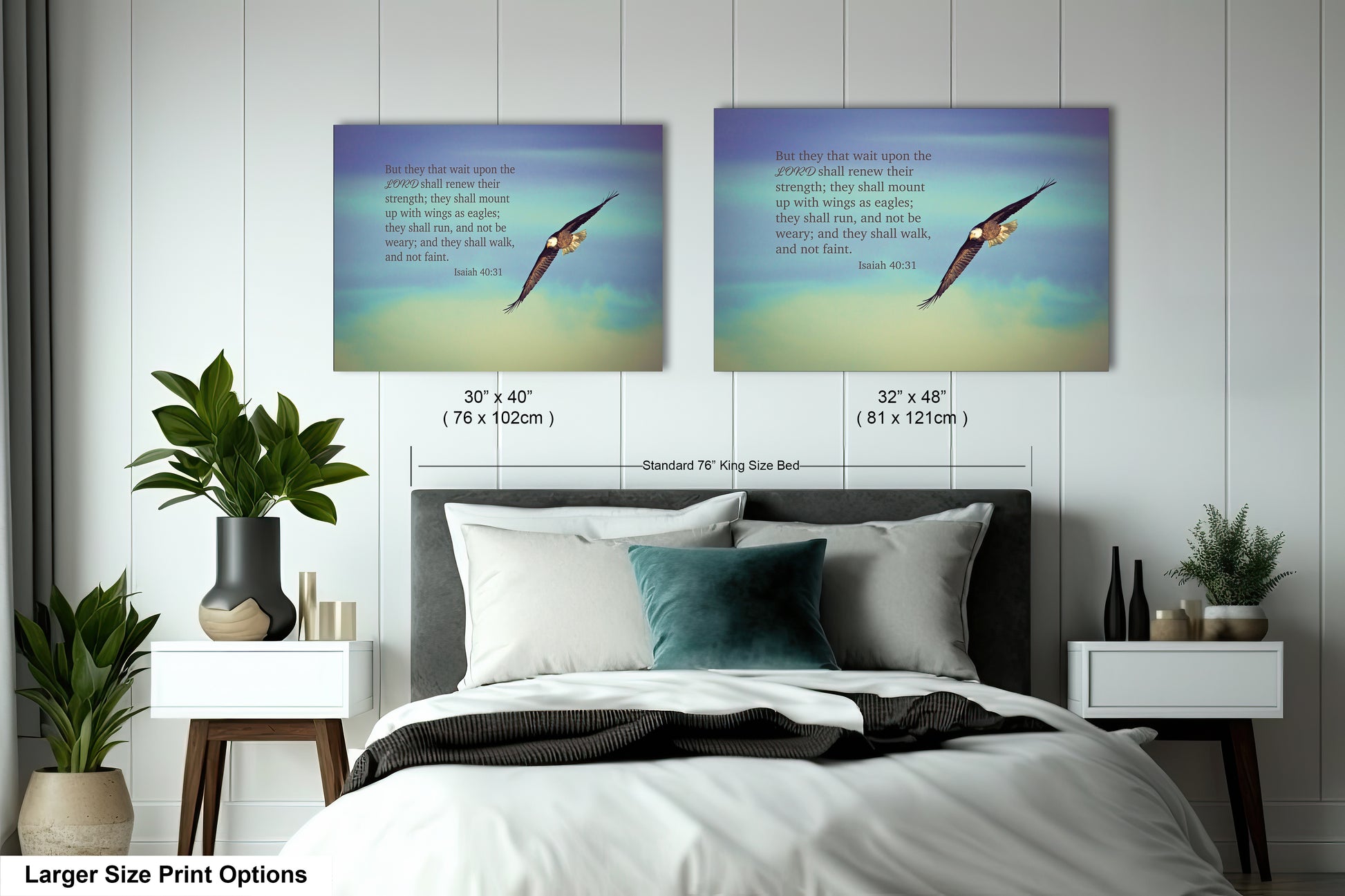 a bed with two pictures of birds above it