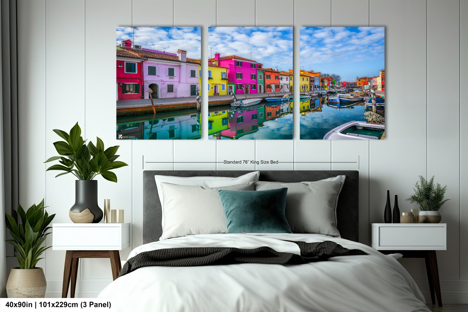 a bed room with a neatly made bed and paintings on the wall