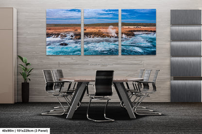 a dining room table with chairs and a painting on the wall