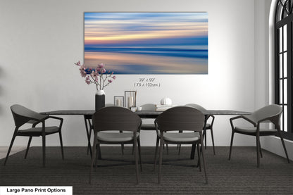a dining room table with chairs and a vase of flowers