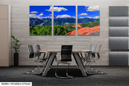 a dining room with a table and chairs with mountains in the background