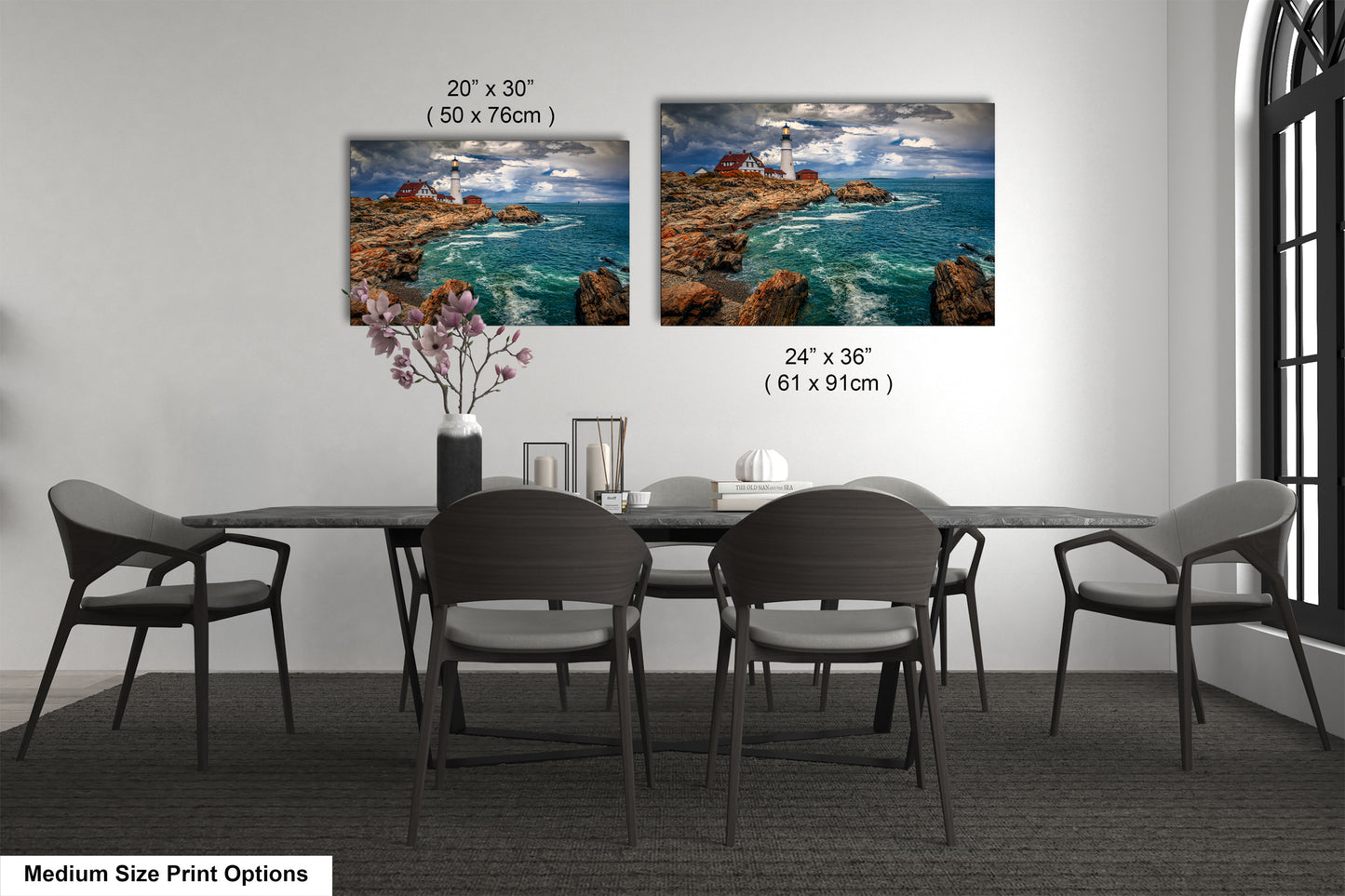 a dining table with four chairs and a vase with flowers