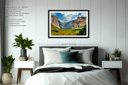 a bedroom with a bed and a picture hanging on the wall