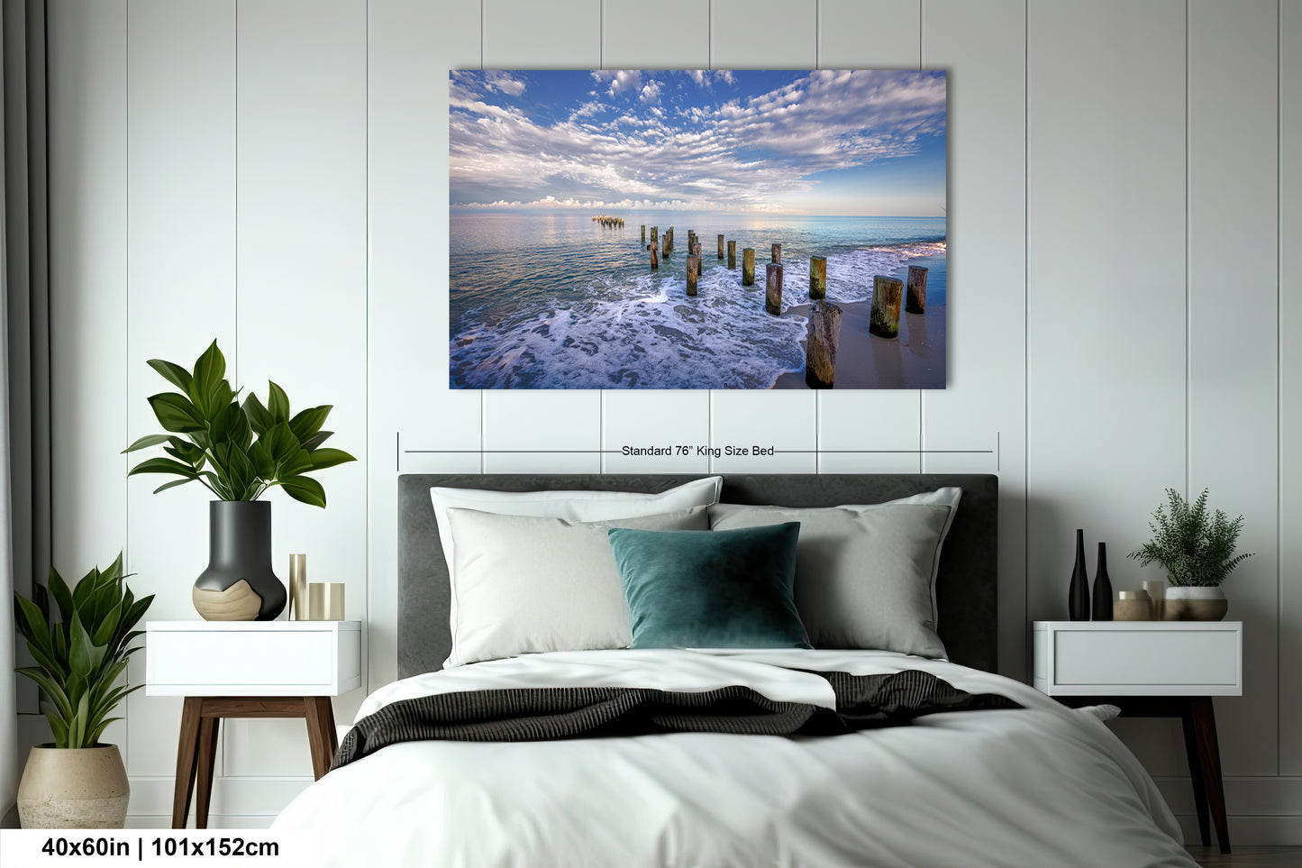 a bedroom scene with focus on the bed and the ocean