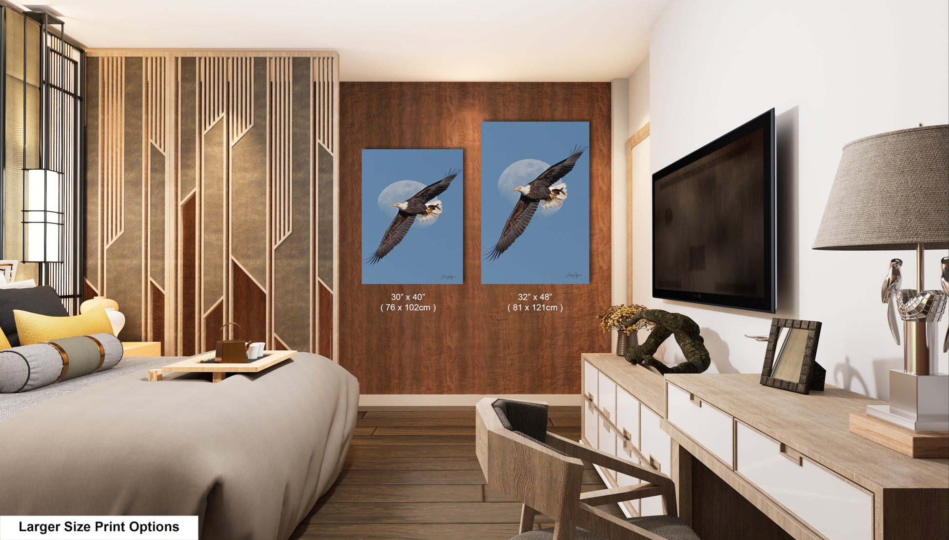 a modern bedroom with a large bed, a television, and a wooden dresser. There are two framed prints of a bald eagle in flight on the wall, and a lamp is also present in the room.