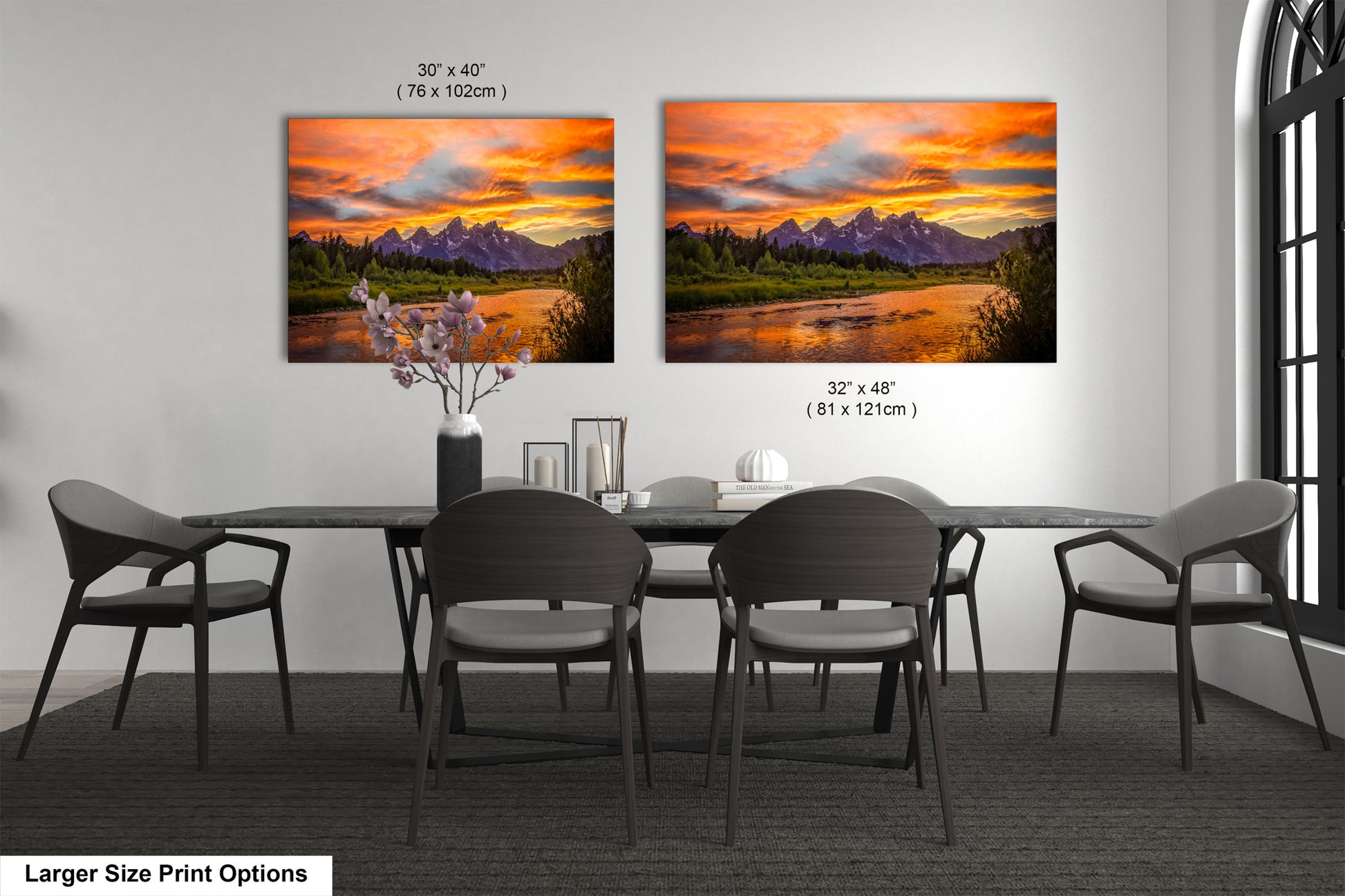 a dining room table with four chairs and a painting on the wall