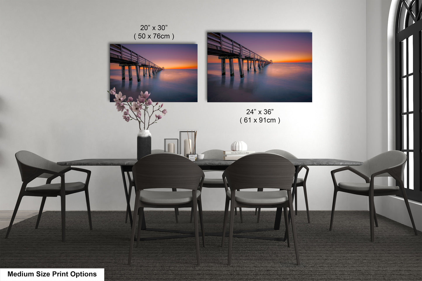 a dining room table with four chairs and a picture of a pier