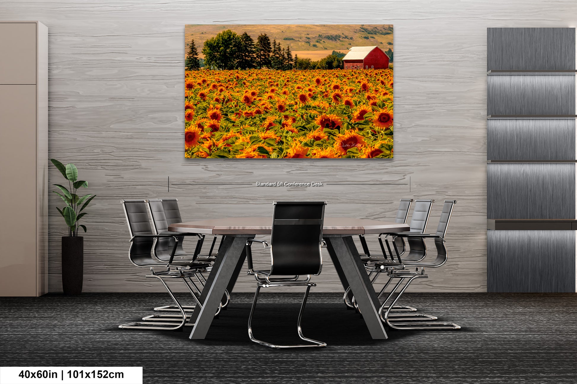 a table and chairs in a room with a picture of a sunflower field