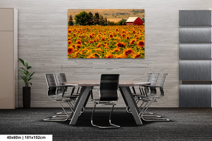 a table and chairs in a room with a picture of a sunflower field