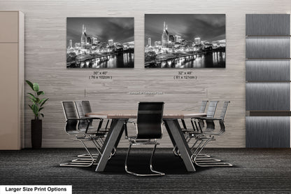 a dining room table with chairs and a picture of a city in black and white