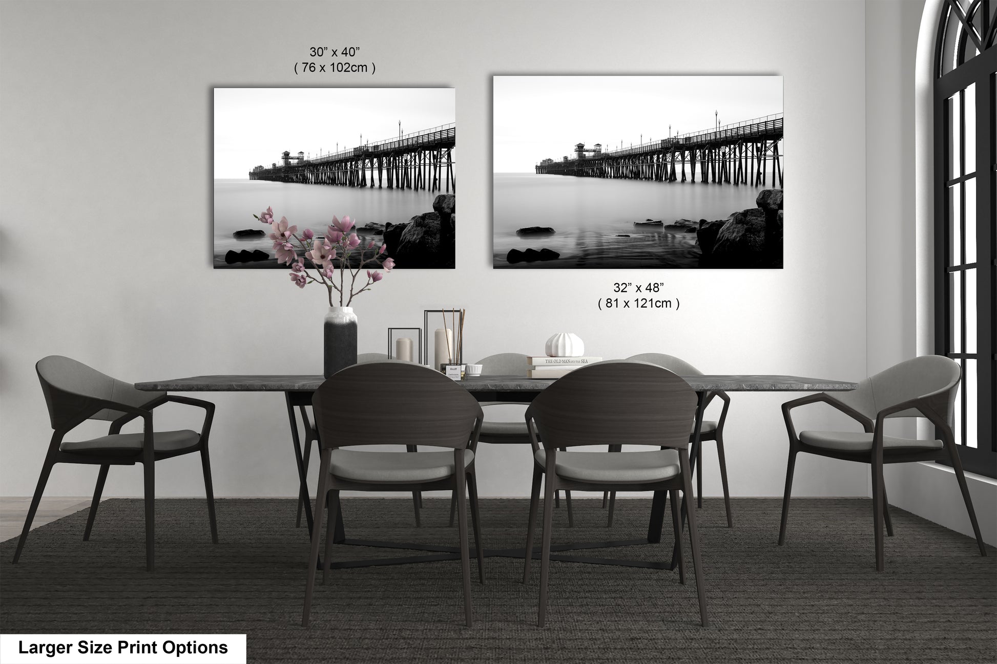 a black and white photo of a dining room table