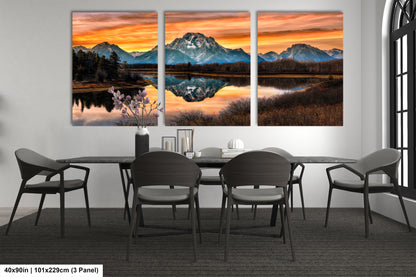 a dining room table with chairs and a painting on the wall