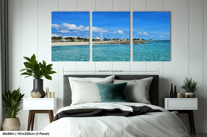 a bedroom scene with a bed and two paintings on the wall