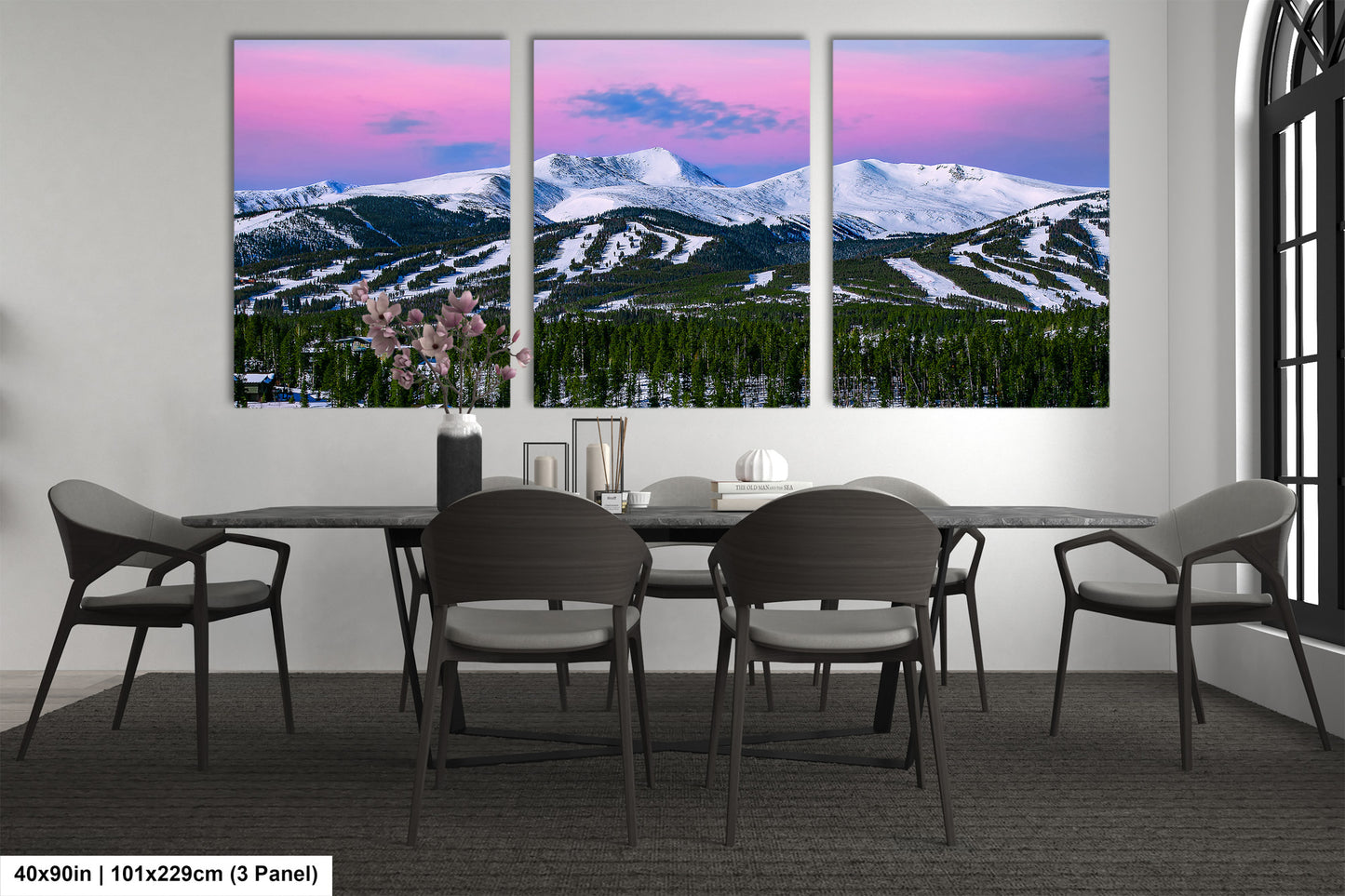 a dining room with a table and four chairs