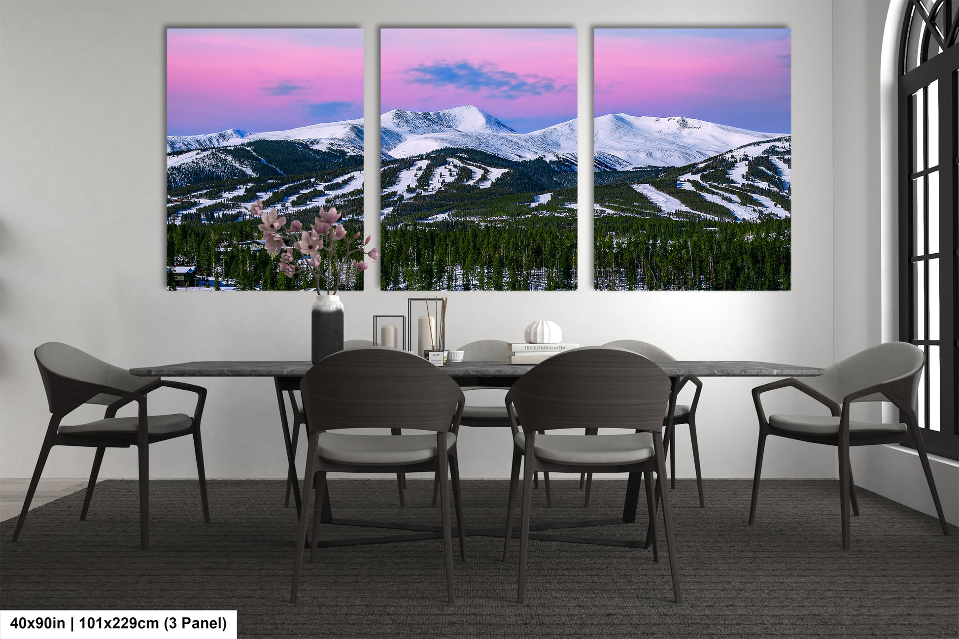 a dining room with a table and four chairs