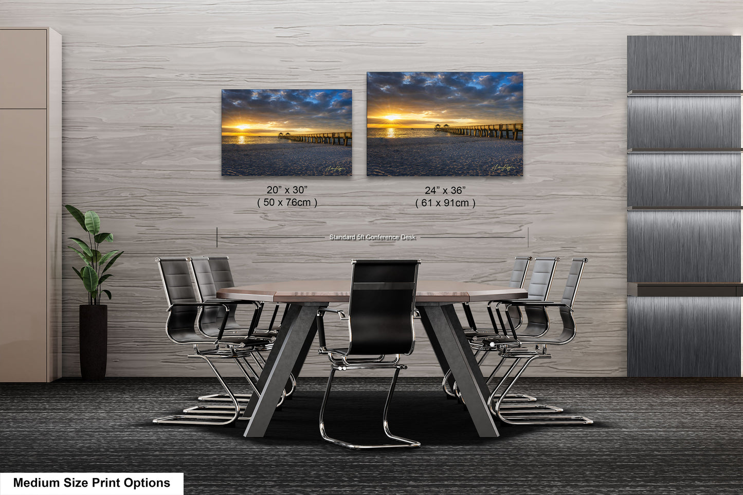 a dining room table with chairs and two pictures on the wall