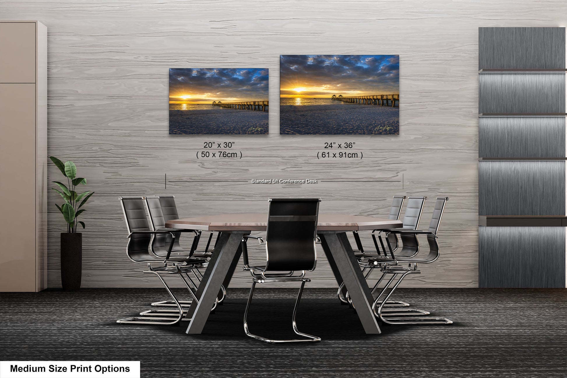a dining room table with chairs and two pictures on the wall