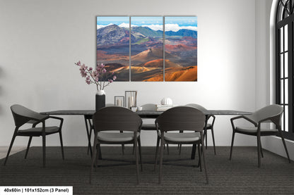 a modern dining room with a large, colorful landscape painting hanging on the wall above a black table surrounded by six chairs.