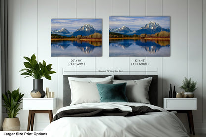 a bedroom with a bed and two pictures on the wall