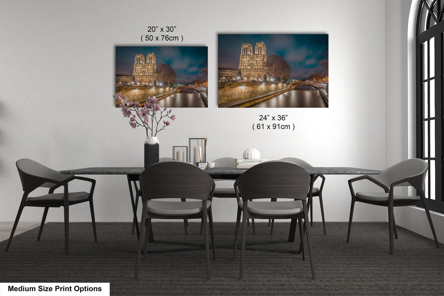 a dining room table with chairs and a vase of flowers