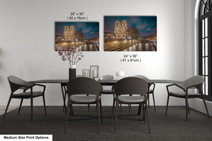 a dining room table with chairs and a vase of flowers