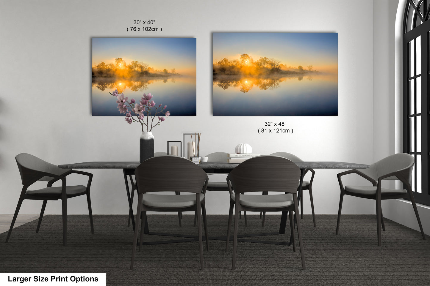 a dining room table with four chairs and a vase of flowers