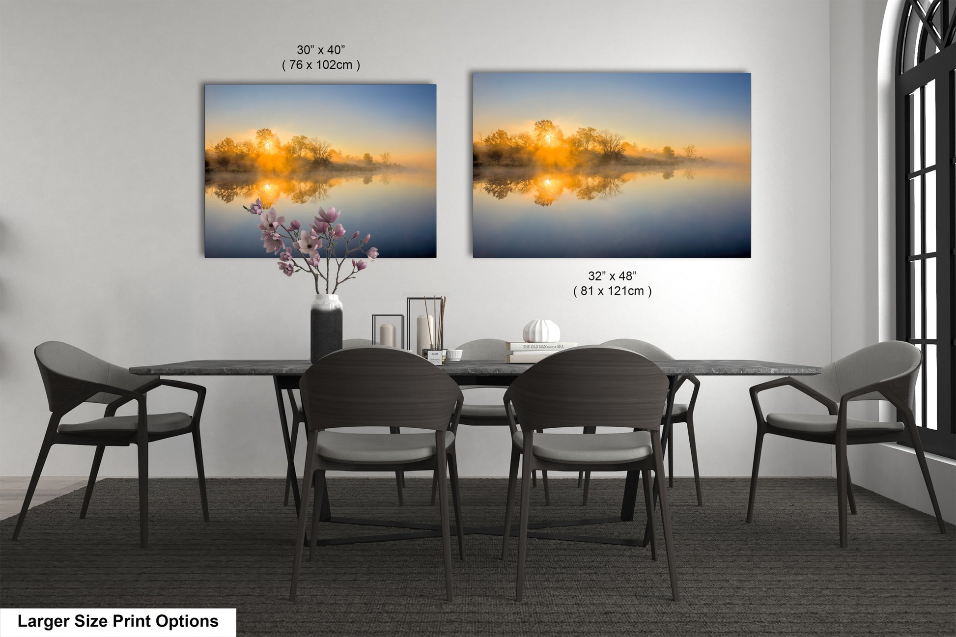 a dining room table with four chairs and a vase of flowers