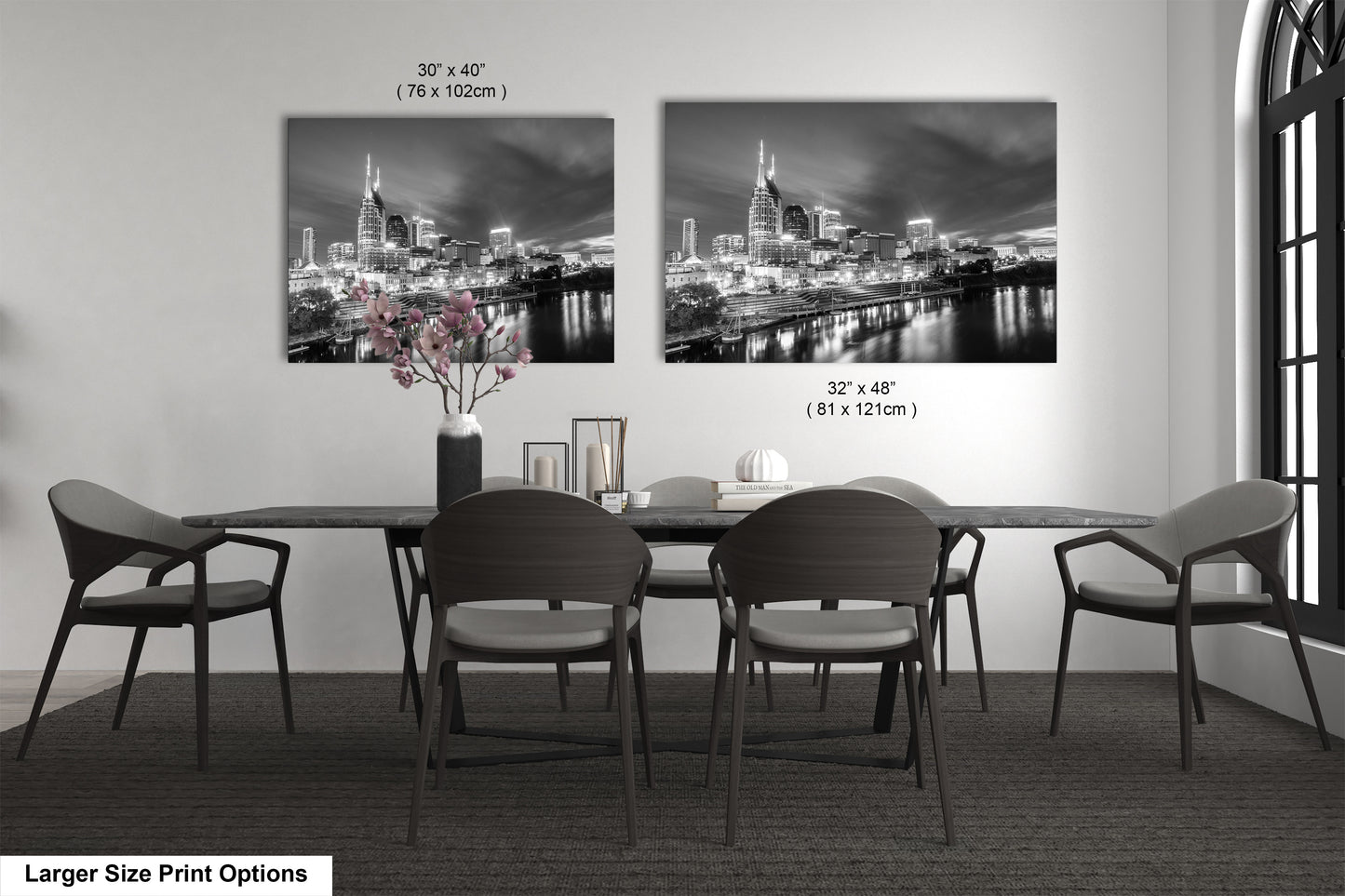 a black and white photo of a dining room table