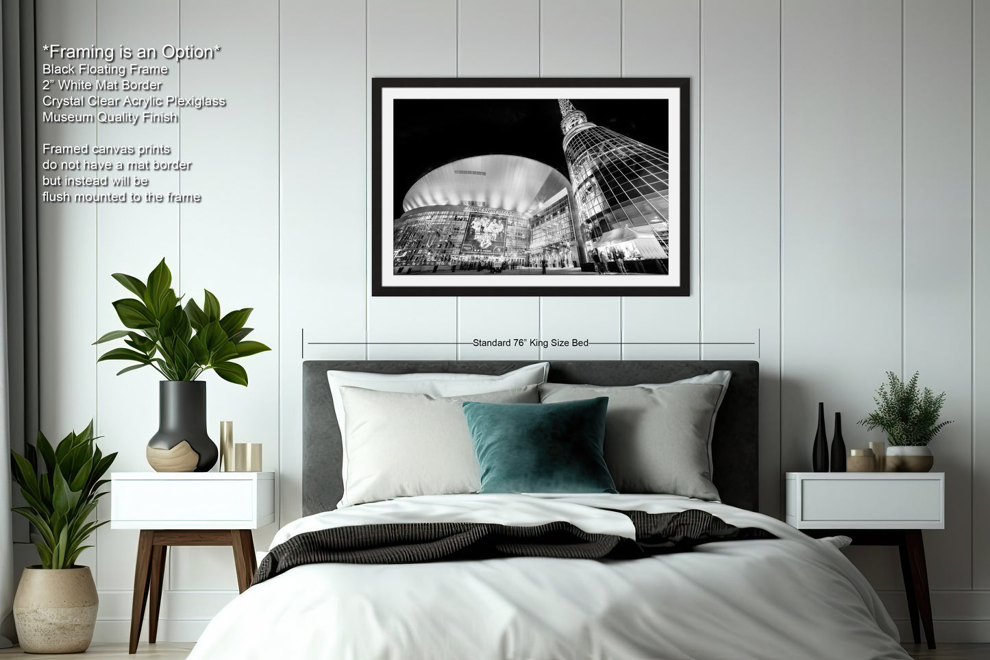 a bedroom with a bed and a picture hanging on the wall