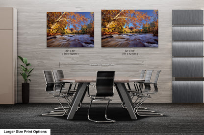 a dining room table with chairs and two pictures of a river