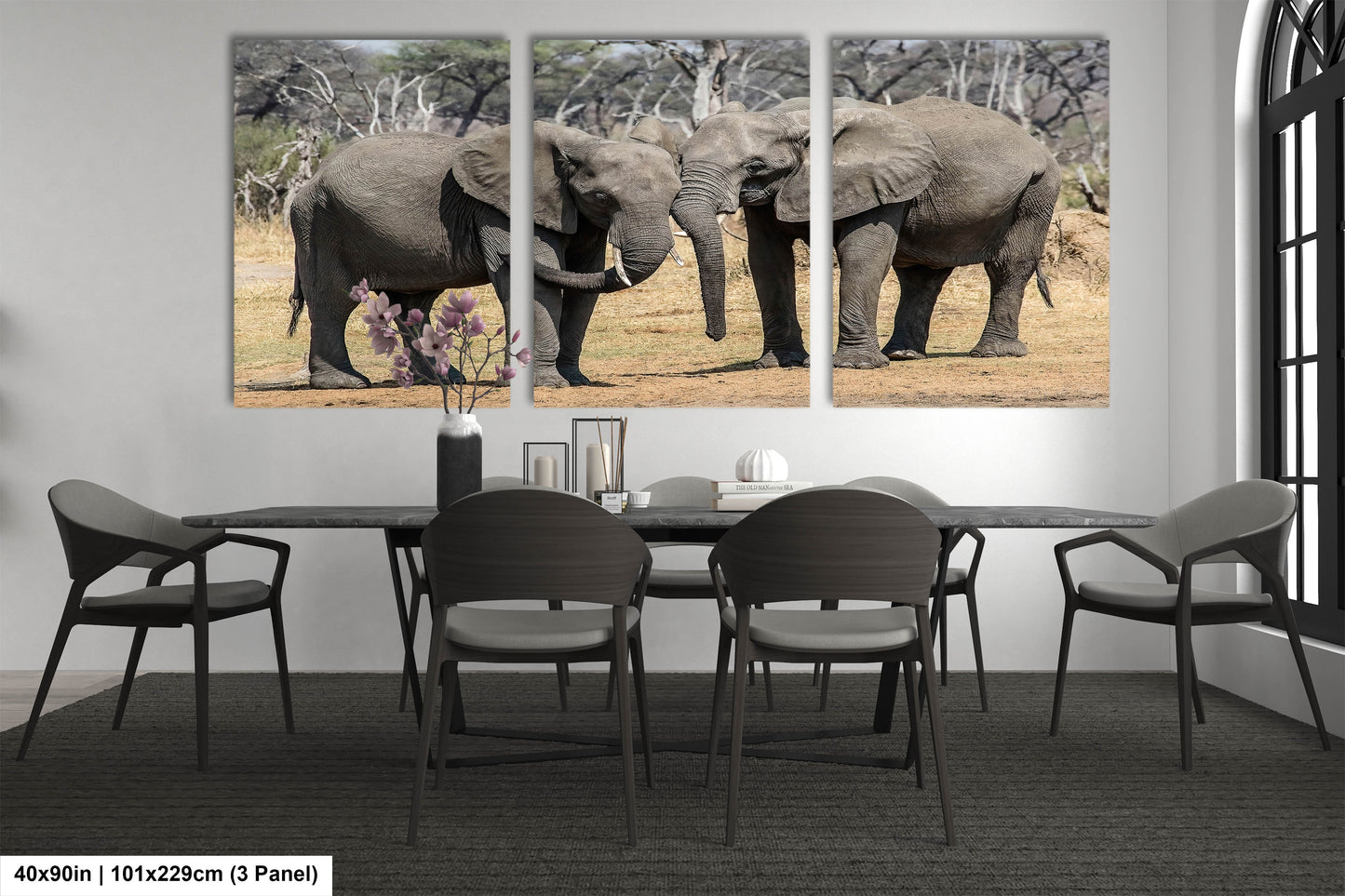 a couple of elephants standing next to each other