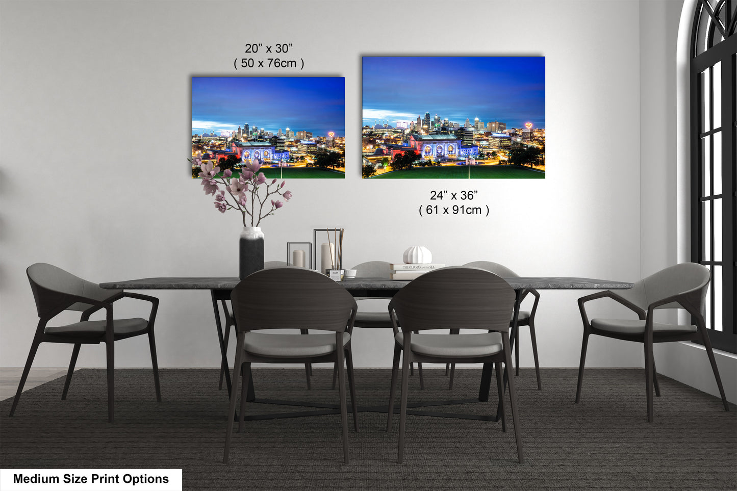 a dining table with four chairs and a vase of flowers