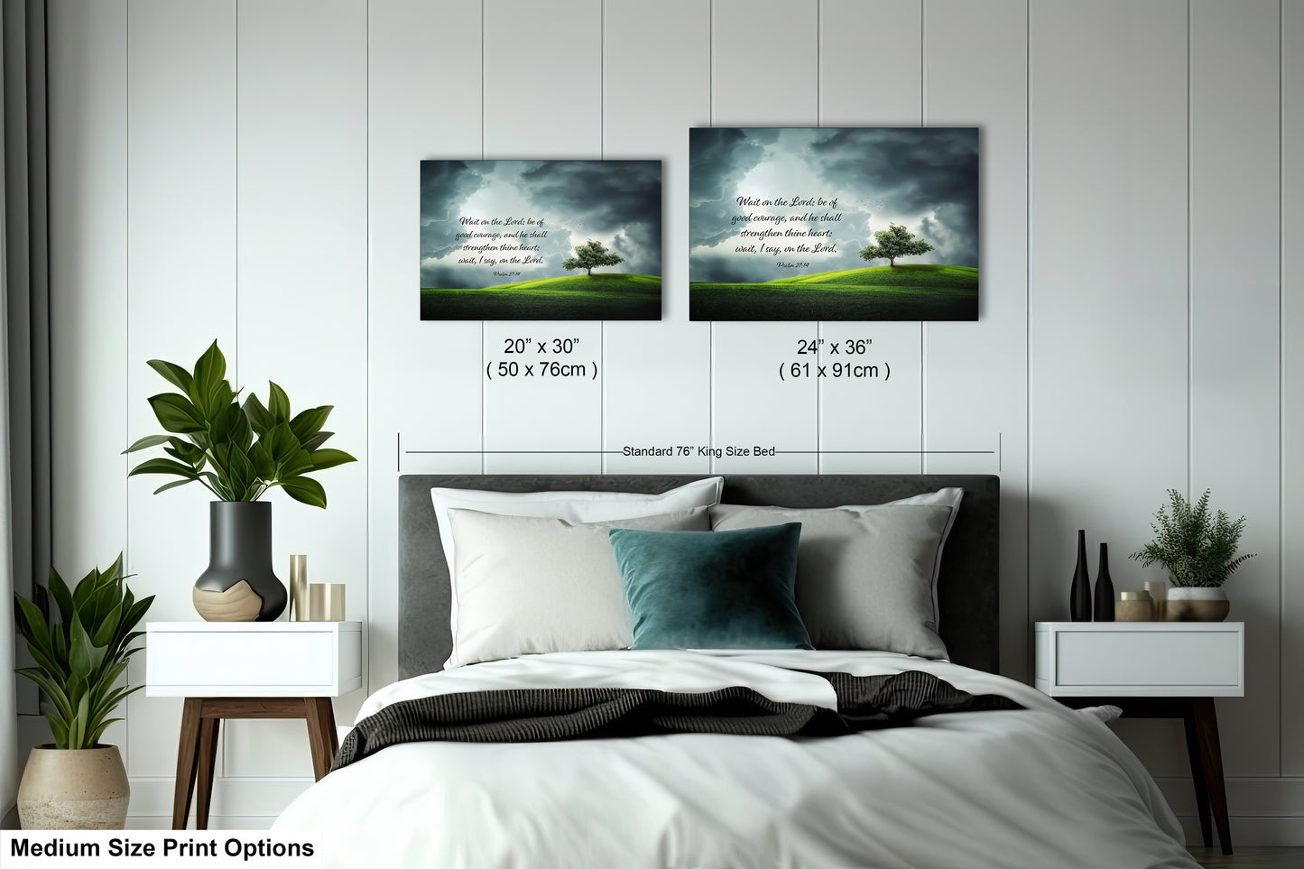 a bed with a white comforter and two pictures on the wall above it
