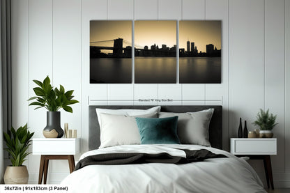 a bedroom with a bed and two paintings on the wall