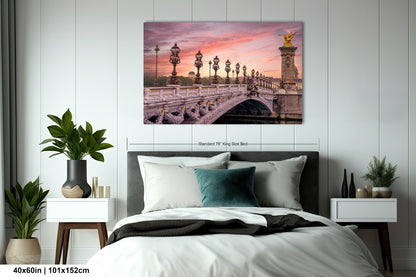a bedroom with a bed and a painting on the wall