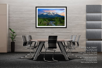 a dining room table with a view of a mountain