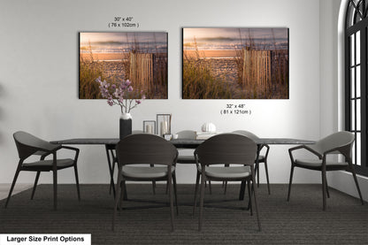 a dining table with four chairs and a vase of flowers