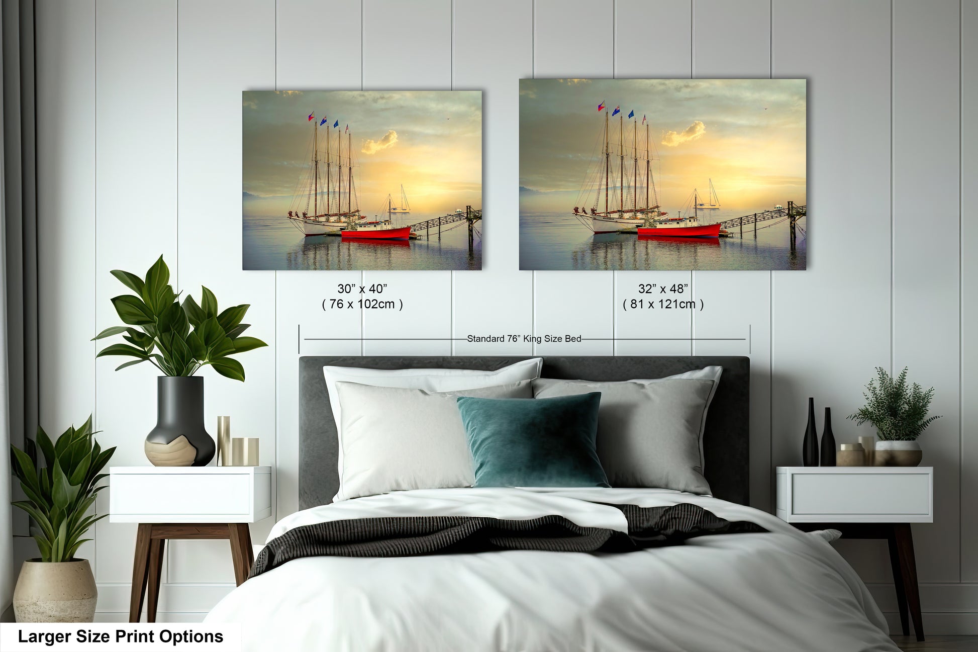 a bedroom with a bed and two paintings on the wall
