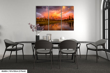 a dining room table with chairs and a painting on the wall
