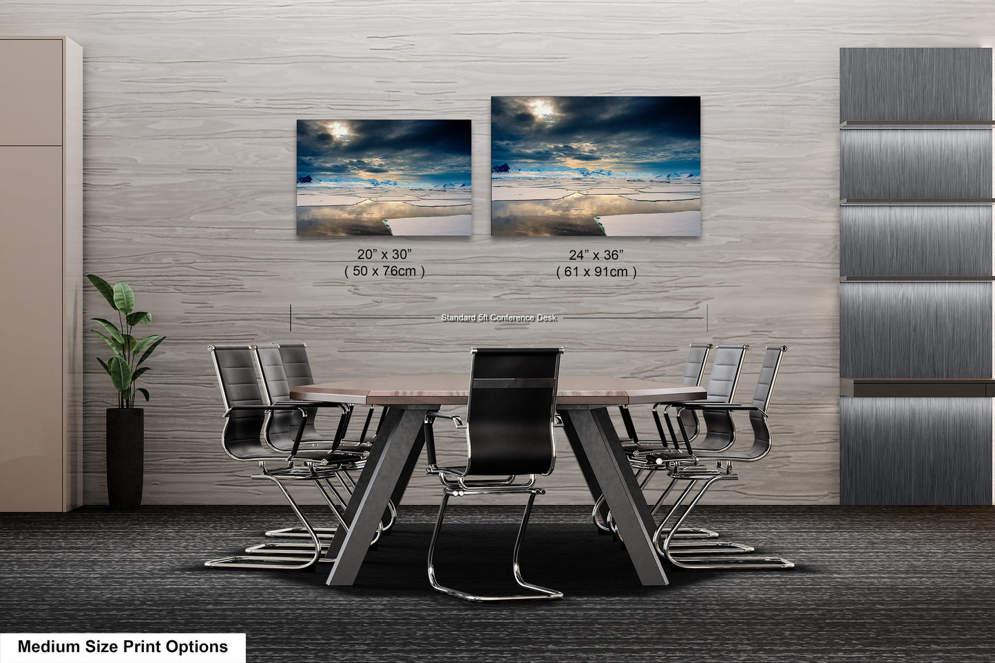 a dining room table with four chairs and two pictures on the wall