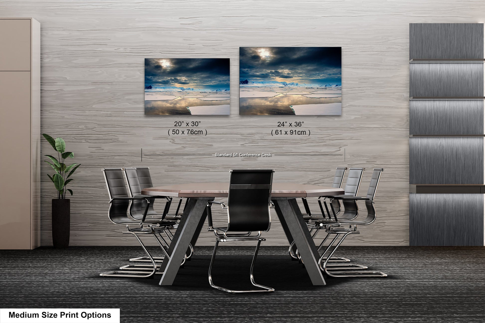 a dining room table with four chairs and two pictures on the wall