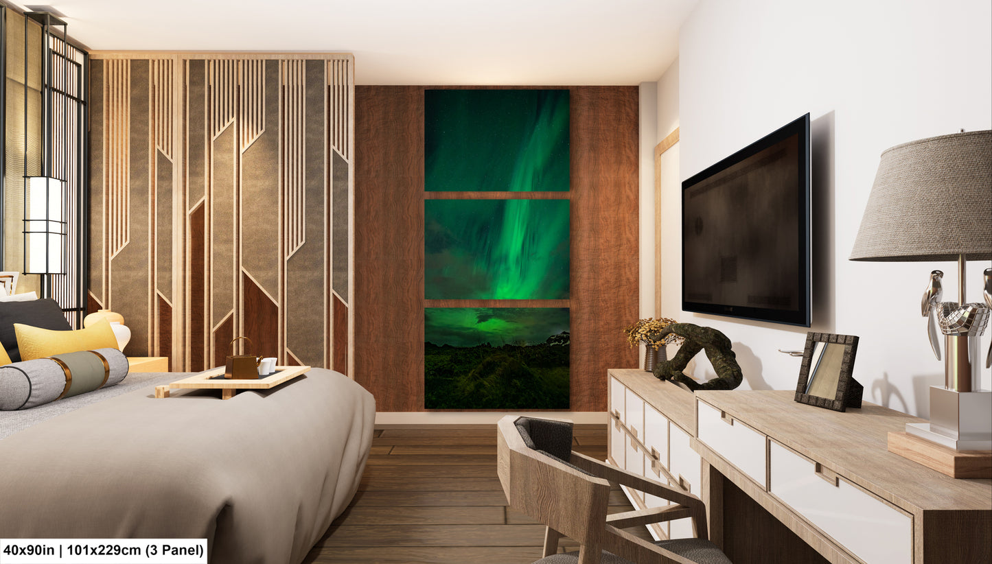 a modern bedroom with a large window that showcases a stunning view of the Aurora Borealis, or Northern Lights, illuminating the night sky. The room is furnished with a bed, a dresser, and a television, creating a cozy and stylish atmosphere.