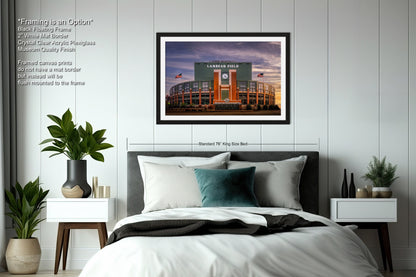 a bedroom with a bed and a picture hanging on the wall