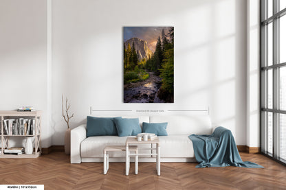 a living room with a white couch and a painting on the wall