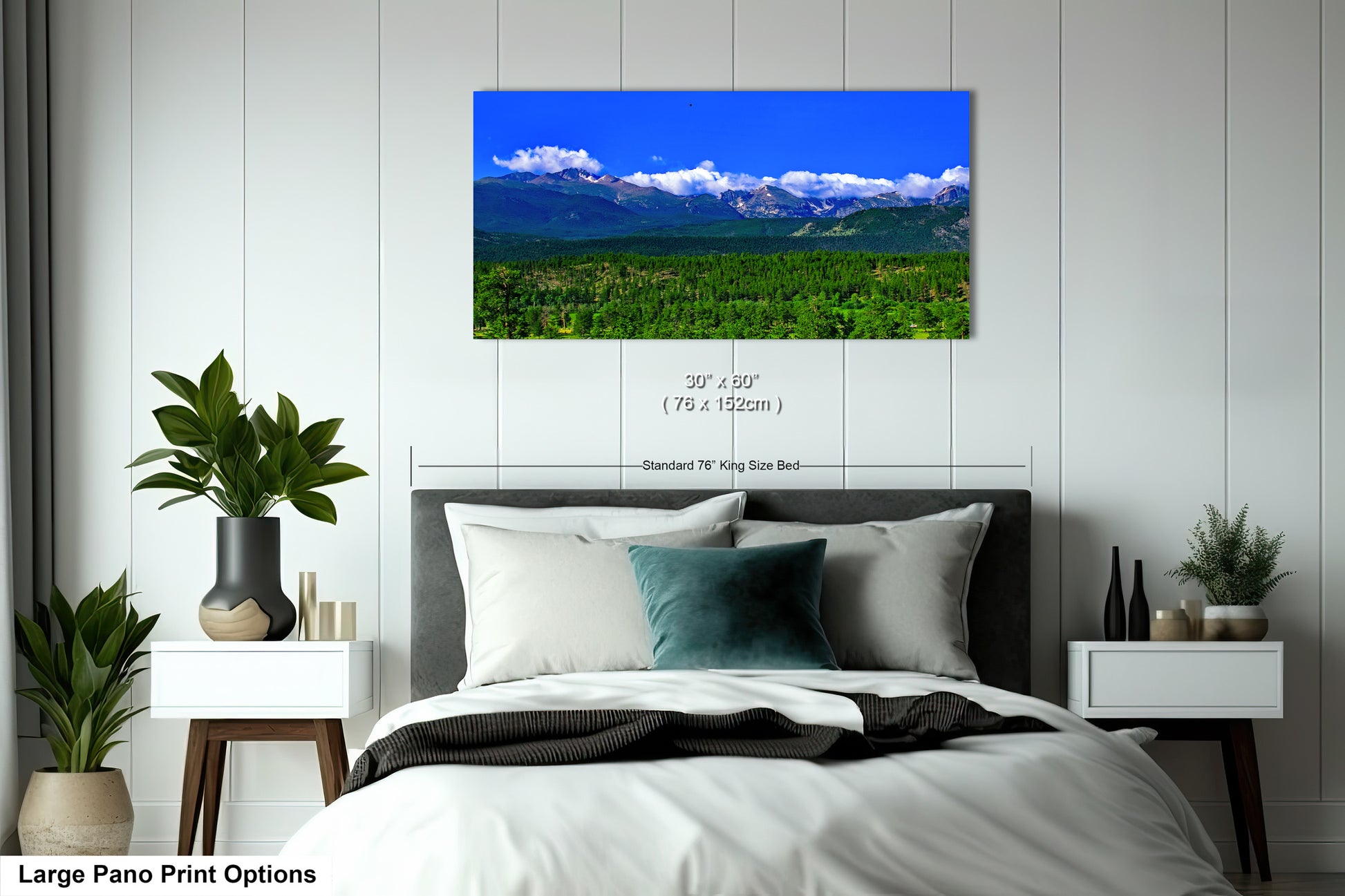 a bedroom with a large bed and mountains in the background