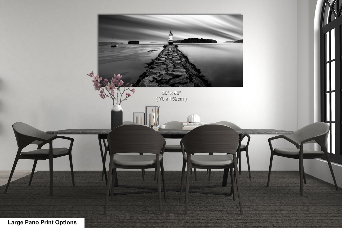 a black and white photo of a table and chairs
